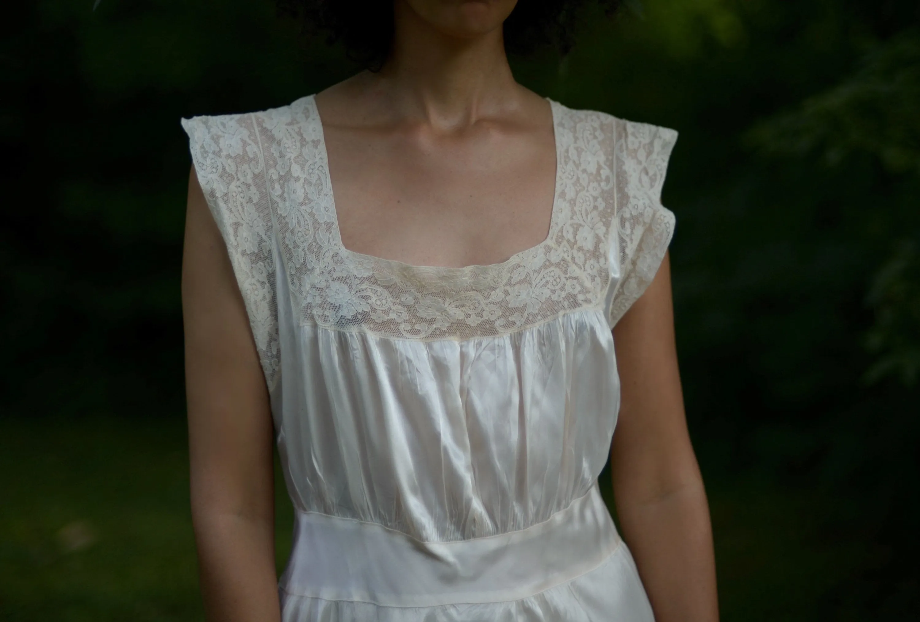 1930s cream satin full length bias cut slip dress with alencon lace trim and deep v back // fits up to large