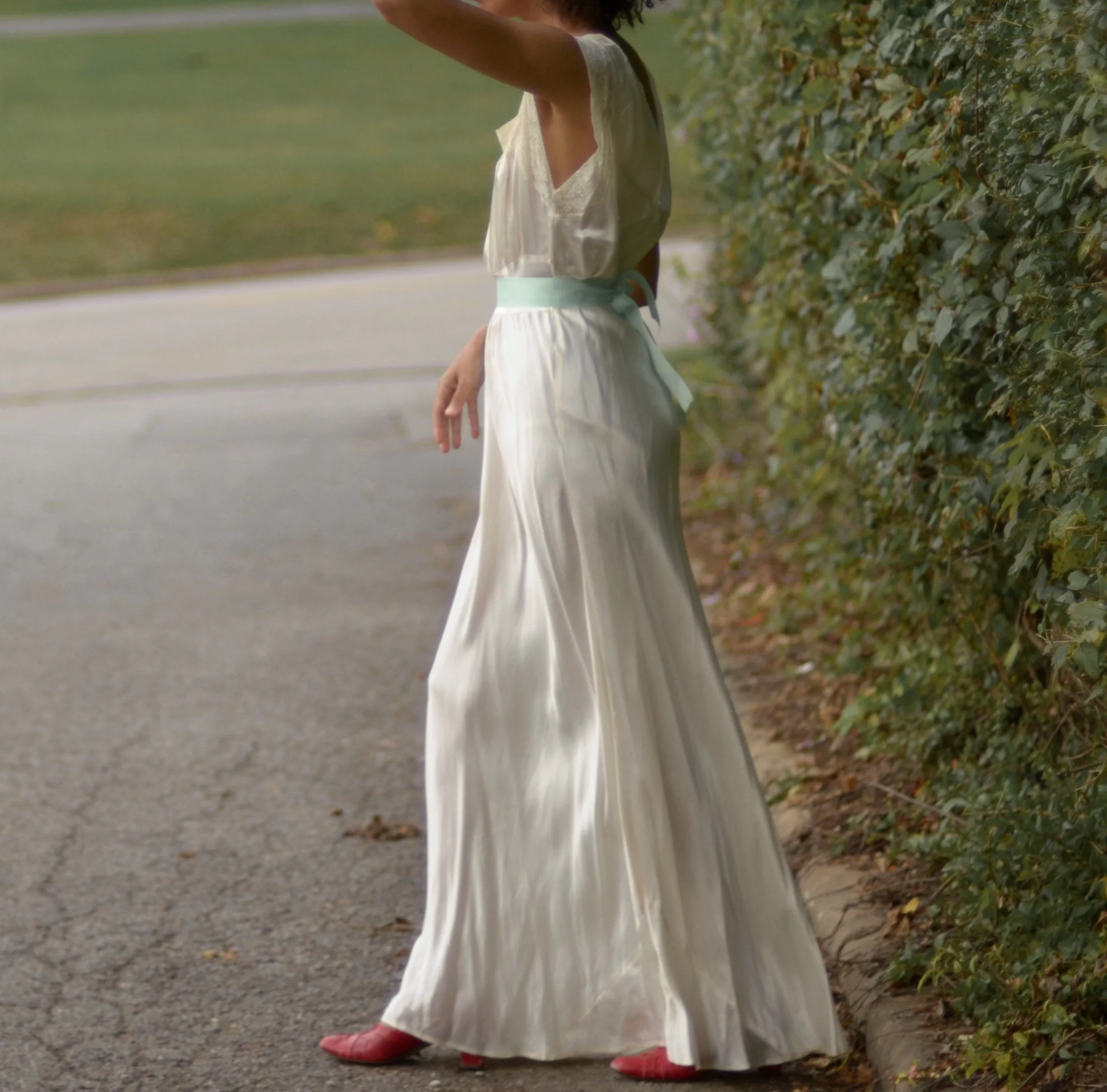 1930s cream satin full length bias cut slip dress with alencon lace trim and deep v back // fits up to large