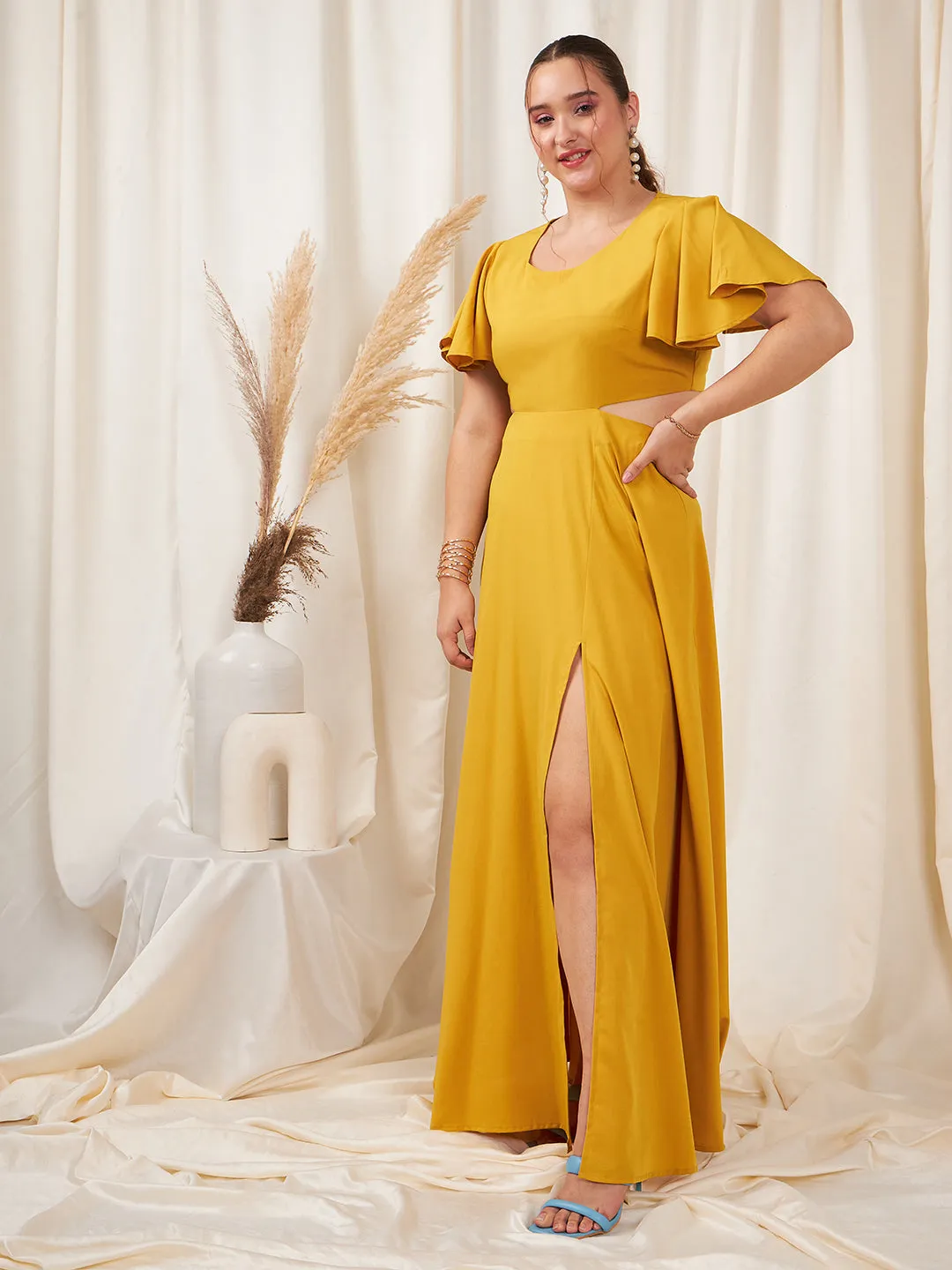 Berrylush Women Plus Size Solid Yellow Round Neck Flutter Sleeve Back Cutout Thigh-High Slit Flared Maxi Dress