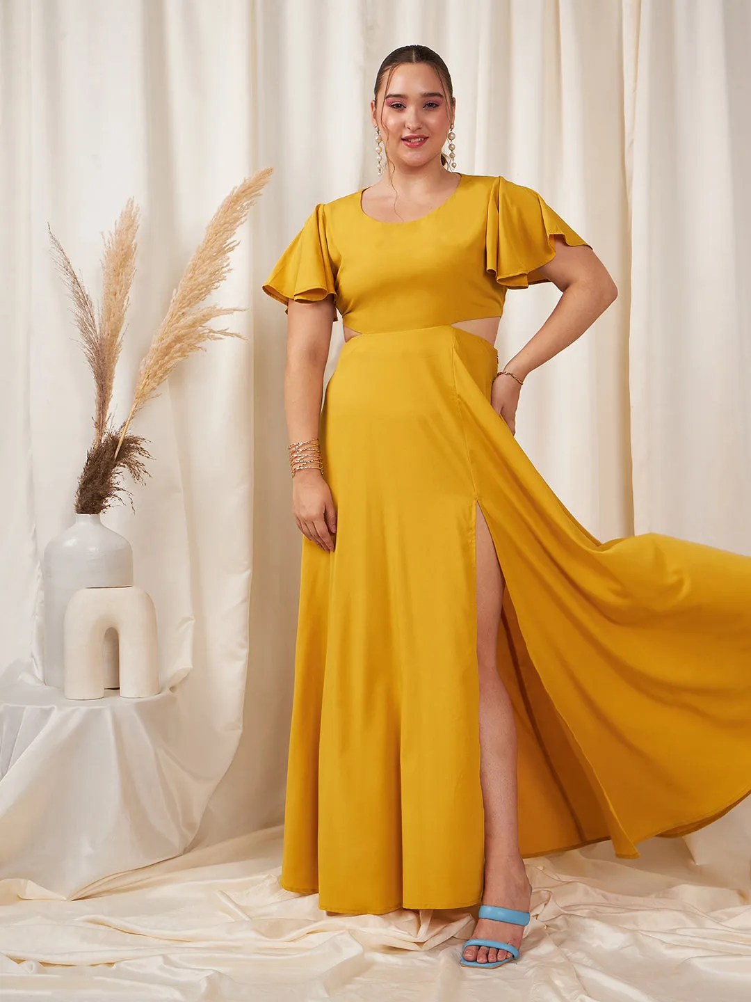 Berrylush Women Plus Size Solid Yellow Round Neck Flutter Sleeve Back Cutout Thigh-High Slit Flared Maxi Dress